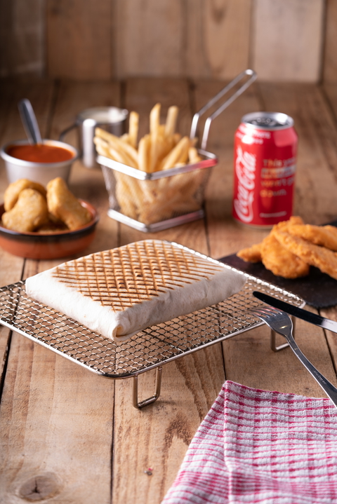 A delicious french tacos meal with coca cola, fries and nuggets, perfect for a fast-food experience.
